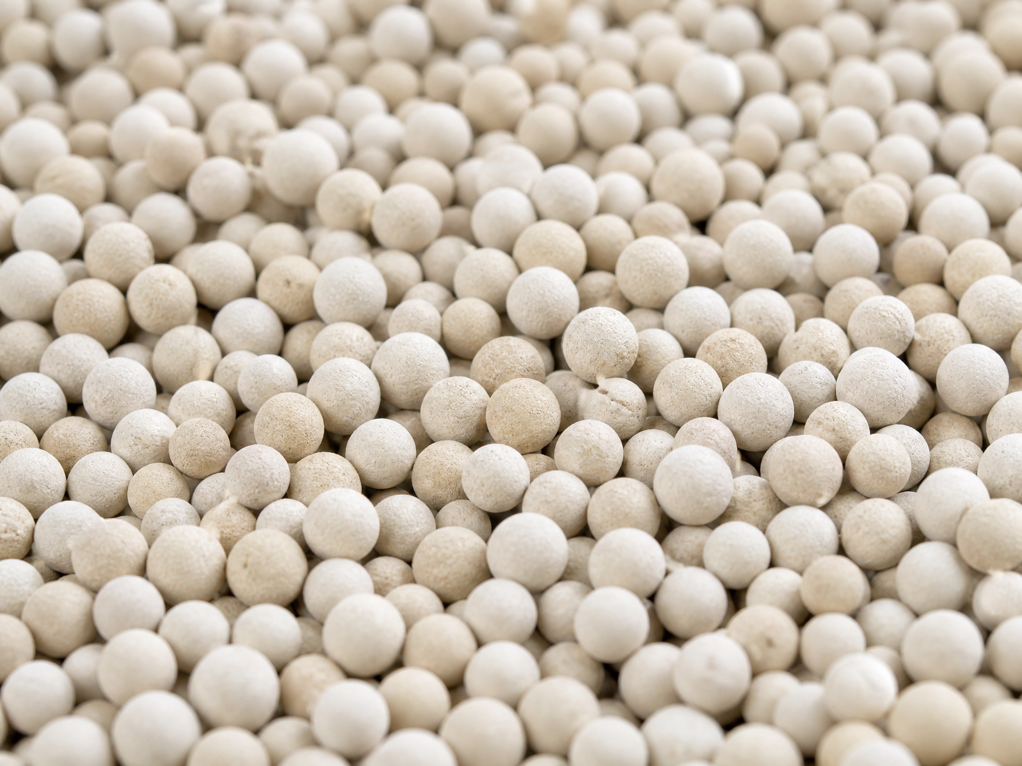 Close-up of premium spherical clay cat litter granules